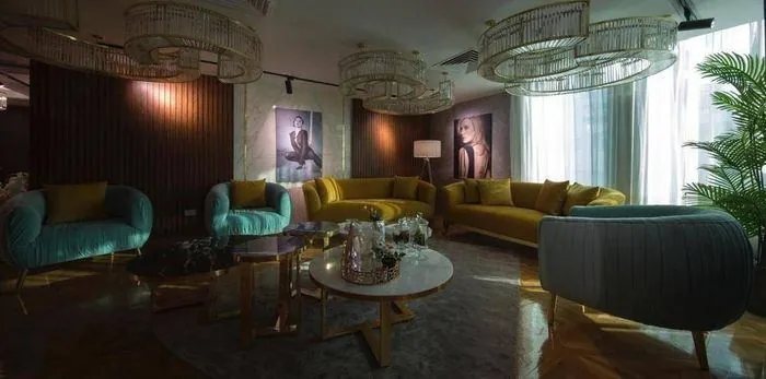 Waiting lounge with teal and gold seating